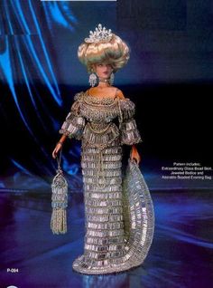 a barbie doll is wearing an elaborate dress