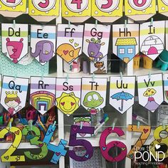 the display is filled with different types of letters and numbers for children to use in their classroom