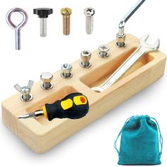 a wooden tool holder with tools in it and some other items to be used on the project