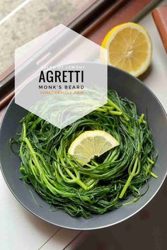 a close up of a plate of food on a table with lemons and greens