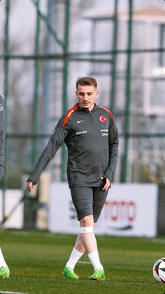 two soccer players are on the field during a practice session for their team's upcoming game