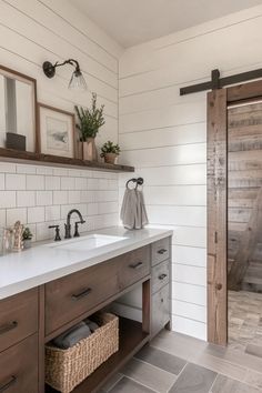 a bathroom with two sinks and wooden doors