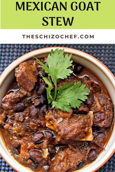 mexican goat stew in a white bowl with cilantro garnish on top