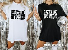 two women in matching t - shirts posing for the camera with disco balls behind them