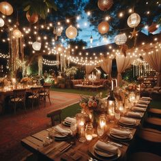 an outdoor dining area with lights strung from the ceiling and tables set up for dinner