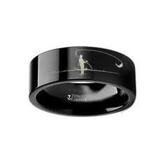 a black ring with an image of a man fishing