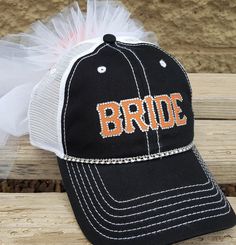 "Baseball Bride Hat for Baseball Game Bachelorette Party! Looking for a themed bridal shower gift? Having a baseball wedding? Going to a baseball game or a football game for your bridal shower, Look no further, this beautiful Bride cap with veil in brides favorite baseball team colors is perfect for your night out and a MUST have for the Bride especially at her baseball game bachelorette party This listing is for ONE Bride hat and veil, you can add groom hat/bridesmaid/maid of honor or any other Baseball Bachelorette Party, Bridal Shower Punch Recipes, Baseball Bachelorette, Bachelorette Party Themed, Tiered Veil, Bridal Shower Punch, Hat And Veil, Themed Bridal Showers, Groom Hat