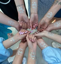 a group of people with their hands in the shape of a circle holding each other