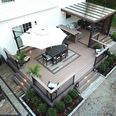 an aerial view of a deck with tables and chairs