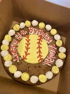 a baseball themed birthday cake in a box