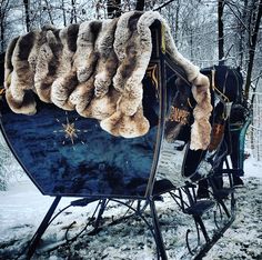 an old fashioned sleigh covered in furs