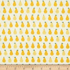 a ruler is next to a yellow and white pattern with pears on the side