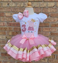 This a beautiful Fairy Pig Themed Tutu Set. This is for one in pink, light Pink, and gold design. If there are any small details you would like added or removed, please contact me prior to ordering. Comes with bodysuit or shirt and ribbon trimmed tutu.  If you are interested on the jacket also please message me for a custom listing. The headband (up to 12/18 months) or hair clip is free with the purchase and may very in design depending on availablity. If you would like something different please leave me a note when checking out. I have a few sizes in stock of long sleeves. Please message me and I can confirm. --------When checking out please leave the Name and Age for the shirt.----------------- If you would like to order the shoes they can be ordered via this link. https://www.etsy.com/ Peppa Big Birthday Shirt, Peppa Pig Birthday Party T-shirts & Tank Tops, Pappa Pig Birthday Shirt, Pink Birthday Outfit, Light Pink Birthday, Peppa Pig Birthday Outfit, Peppa Pig Outfit, Woman Costumes, Ribbon Trim Tutu