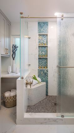 a bathroom with a walk in shower next to a sink