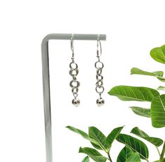 Add a touch of elegance to your outfit with these stunning Sterling Silver Drop Earrings. The intricate chainmail design gracefully dangles from your ear lobes, creating a stylish and unique accessory. These earrings are perfect for any occasion, giving you a sense of sophistication and charm. Material: High Quality Solid 925 Sterling Silver                    Sold as a pair Packaged:   In our eco-friendly branded box with a complimentary cleaning cloth.  Shipping:    We offer free shipping for Chainmail Earrings, Handmade Silver Jewellery, Sterling Silver Drop Earrings, Celestial Jewelry, Silver Drop Earrings, Silver Jewellery, Accessories Unique, Cleaning Cloth, Solid 925 Sterling Silver