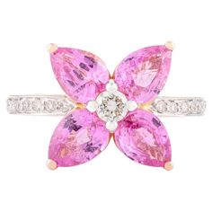 Pear Cut Pink Sapphire Diamond Floral Ring for Wedding in 14K Gold featuring natural pink sapphire of 3.57 carats and diamonds of 0.27 carats. The gorgeous handcrafted ring goes with every style. Sapphire stimulates concentration and reduces stress. Designed with pear cut pink sapphire set in center making a flower with diamonds on band that makes it a perfect fit to wear it on your occasion or style it with any of your basic outfit to give it a glam. This is a perfect Handmade Jewelry, Bridal Shower Gift, Valentine Gift, Gift For Sister, Mother Daughter Gift, Bride To Be Gift, Bridesmaid Gift, Mom Gift, BFF Gift, Best Friend Gift, Anniversary Present, Wife Gift, Gift for Her or any Holiday Gift for Mother, Sister, Daughter, Grandma, Fiancé, Girlfriend, Valentine, Family or Friend on your Making A Flower, Ring For Wedding, Bff Gift, Wedding Ring Sizes, Mother Daughter Gifts, Gold Gemstone Ring, Floral Ring, Gift Valentine, Jewelry Bridal