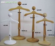 three wooden mannequins are shown with measurements for each individual item on the table