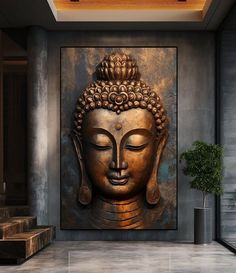 a large buddha statue sitting on top of a wall next to a potted plant