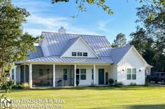 a white house with a blue tin roof