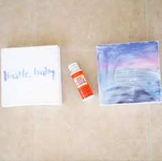 a tile floor that has some paint on it and a box with the words waste, paper next to it