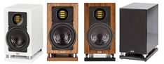 three speakers are shown side by side in front of each other, one is white and the other is brown