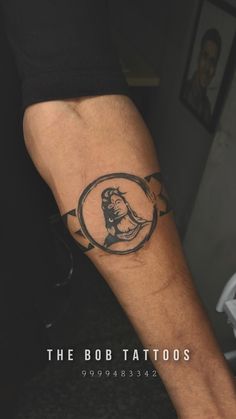 a man's arm with a tattoo on it that reads the bob tattoos,