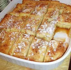 a casserole dish filled with lots of powdered sugar on top of it