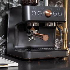 an espresso machine sitting on top of a counter