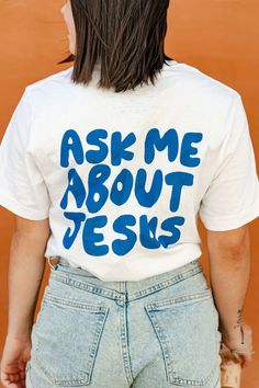 Ask Me About Jesus Christian Shirt. This t-shirt is everything you've dreamed of and more. It feels soft and lightweight, with the right amount of stretch. It's comfortable and flattering for all. Shirt Info: * 100% combed and ring-spun cotton (Heather colors contain polyester) * Fabric weight: 4.2 oz/yd² (142 g/m²) * Pre-shrunk fabric * Side-seamed construction * Shoulder-to-shoulder taping * Blank product sourced from Guatemala, Nicaragua, Mexico, Honduras, or the US Bible Shirt, Letter Designs, Jesus Clothes, Bible Shirts, Christian Shirts Designs, Love Like Jesus, About Jesus, Jesus Shirt, Streetwear Aesthetic