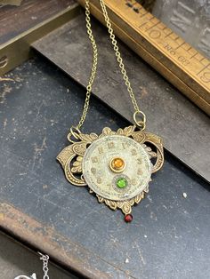 Daisy, Elegant Watch Movement Necklace  #Steampunk #gothic #fantasy #ilm #handmade #industrialdesign #steampunkart #handmadejewelry #history #upcycled Movement Jewelry, Book Locket, Industrial Jewelry, Steampunk Necklace, Steampunk Jewelry, Watch Movement, Brass Frame, Oxidized Sterling Silver, Color Crystal