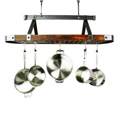 three pots and pans hanging from a rack