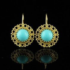 Gold Turquoise Earrings Wire Back Drop Gemstone Blue Stone Antique Reproduction Antique reproduction with twisted wire work set with a cabochon turquoise (Approx. 1.6cttw, 9mm x 9mm) and wire back gold. Earrings are 15mm tall and 15mm wide (6/10 x 6/10 inch) and made of 14k yellow gold. PROUDLY MADE FROM SCRATCH IN NEW YORK CITY. SKU: E233MA Our Pledge: 1. All items to be BRAND NEW and authentic. 2. All gemstones to be 100% genuine and mined from the earth. 3. Jewelry guaranteed to be solid 14kt Round Cabochon Earrings In Fine Jewelry Style, Elegant Handmade Turquoise Earrings, Elegant Turquoise Gemstone Earrings, Elegant Turquoise Pierced Earrings, Turquoise Drop Earrings For Formal Occasions, Fine Jewelry Turquoise Earrings, Turquoise Cabochon Earrings For Formal Occasions, Turquoise Pierced Earrings In Fine Jewelry Style, Turquoise Fine Jewelry Earrings