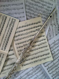 sheet music with musical notes and a flute