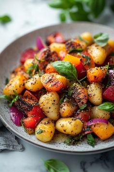 Grilled gnocchi with roasted vegetables and fresh basil served in a grey bowl. Traditional Gnocchi Recipes, Goat Cheese Gnocchi, Potato Gnocchi Recipes Dinners