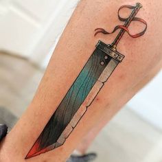 a tattoo on the leg of a person with a knife in it's blade