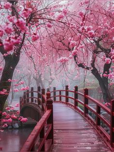 a red bridge with pink flowers on it