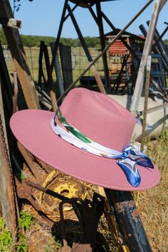 Flat and structured brim vegan rancher hat with removable stylish scarf trim. Wear throughout the seasons and special holidays from Easter to Memorial Day to Fourth of July! Trendy Winter Hats For Country Events, Pink Wide Brim Fedora For Fall, Casual Wide Brim Felt Hat For Kentucky Derby, Casual Pink Fedora For Winter, Casual Pink Winter Fedora, Pink Wide Brim Hat For Fall, Country Style Wide Brim Fedora For Winter, Trendy Wide Brim Fedora For Country Events, Spring Outdoor Felt Hat With Curved Brim