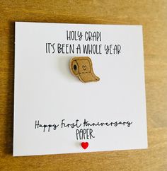 "The perfect card for your other half or for a couple on your their first anniversary- Paper!  A white square 16cm x16cm featuring a cut out and black pen drawn toilet roll.  The text reads \" Holy crap it's been a whole  year! Happy first Anniversary paper.\" The card is embellished with a red sequin heart in the centre at the bottom of the card.  Card comes with envelope and blank red inserts for your personal message." 1 Year Anniversary Card, Happy First Anniversary, Work Anniversary Gifts, First Anniversary Paper, Anniversary Cards Handmade, Funny Anniversary, Happy Anniversary Cards, Funny Anniversary Cards, Work Anniversary