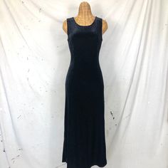 "Black stretch velvet long dress; the perfect not-so-basic basic!  Best fits: S Measurements:  Bust: 31-39,\" Waist: 26-31,\" Hips: 32-40,\" Length: 52.5\" Condition:  Very good vintage condition Shop notes: All vintage items have a past, as such they may have minor imperfections. I do my best to mend anything major and call out what cannot be fixed.  All garment measurements are taken flat.  I ship in reusable, sustainable packaging in an effort to be more environmentally friendly.  Thank you for supporting my small business and I'm happy to answer any questions you may have!  All sales final." Fitted Long Velvet Dress, Fitted Velvet Maxi Dress, Fitted Velvet Maxi Dress For Night Out, Long 90s Dress, 90s Black Dress, Black Velour Dress, Velvet Long Dress, Long Velvet Dress, 90s Velvet