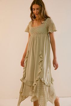 Romantic and ethereal, this sweet midi from our free-est collection is a true throw-on-and-go staple. **Fit:** Shapeless, babydoll-inspired silhouette **Features:** Square neckline, embroidered lace piecing, ruffle trimming throughout, back tie closure, flutte sleeves **Why We ❤ It:** Laid back with sporty sneakers or elevated with sleek platforms, this style has endless ways to wear. | Bring The Romance Midi Dress by free-est at Free People in Green, Size: XS Western Boho Dress Outfit, Boho Dress Outfit, Sporty Sneakers, Free People Clothing Boutique, Pretty Clothes, Western Boho, Pinterest Board, Wedding Pinterest, Flutter Sleeves