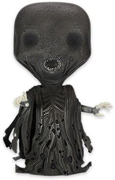 an alien figurine is shown on a white background