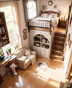 a bedroom with a loft bed, desk and stairs leading up to the second floor