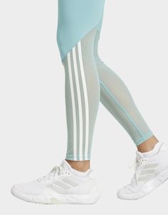 These adidas leggings are designed to move seamlessly through your toughest workouts and your busiest days. They feature a sleek, high-waisted cut that pairs perfectly with your favourite sports bra or crop top. Mesh panels add breathability. A repeating performance logo on the jacquard elastic waistband and printed 3-Stripes on the legs show off your adidas pride. This product is made with at least 70% recycled materials. By reusing materials that have already been created, adidas help to reduce waste and our reliance on finite resources and reduce the footprint of the products adidas make.• This model is 175 cm and wears a size S. Their chest measures 96 cm and the waist 62 cm.• Tight fit• Stretch waist• 85% polyester (recycled), 15% elastane• Sleek, bodyhugging feel• AEROREADY• High ris Adidas Leggings, Reduce Waste, Jd Sports, White Adidas, Recycled Materials, Sports Bra, Tights, Crop Top, High Waisted