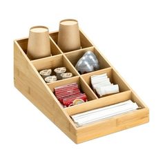 a wooden box with compartments filled with different items