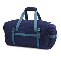 a large blue duffel bag with straps on the front and side pockets, sitting against a white background