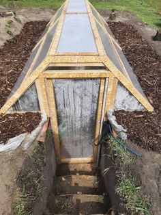 a small greenhouse built into the ground