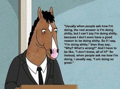 a horse wearing a suit and tie sitting in front of a wooden table with a quote written on it