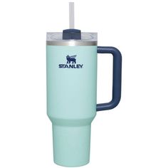 the stanley travel mug is light blue and has a handle