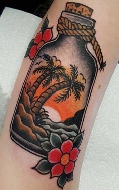 a bottle filled with water sitting on top of a woman's leg next to a palm tree