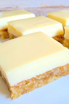 several pieces of cake sitting on top of a white plate